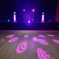 Disco Hire Near Me - Empty dance floor showing the disco with pink logos on the dance floor