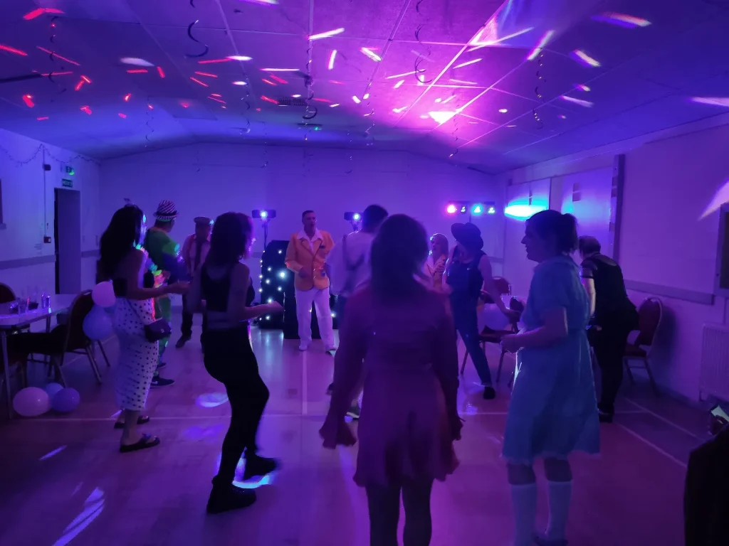 Guests dancing at a wedding DJ event by Mindy’s Roadshow